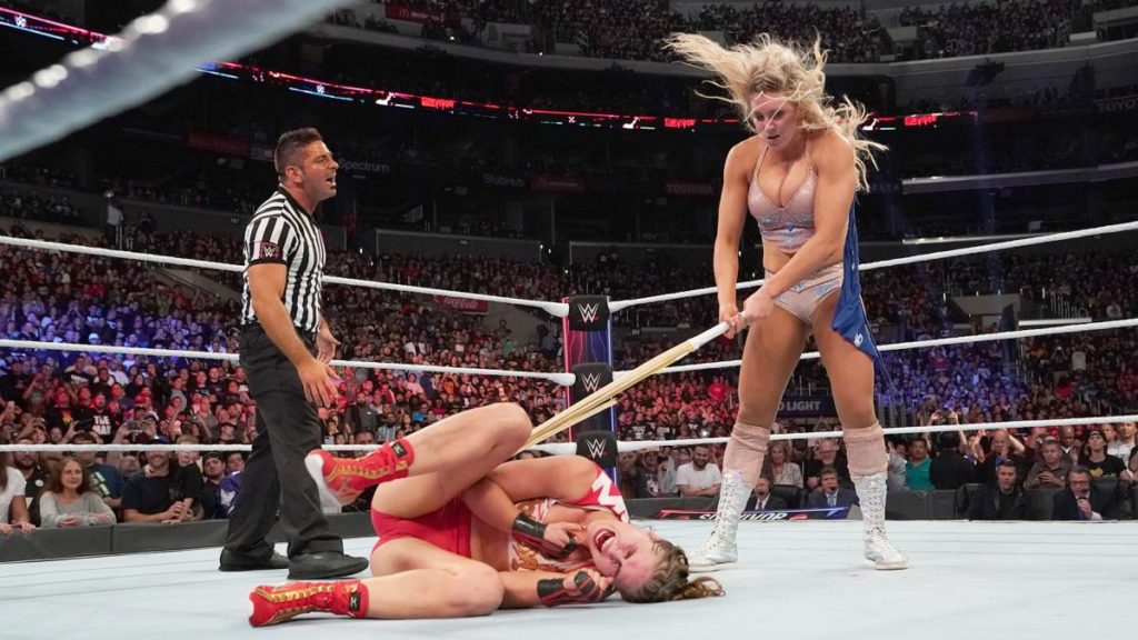 Ronda Rousey, Charlotte Flair (source: WWE_